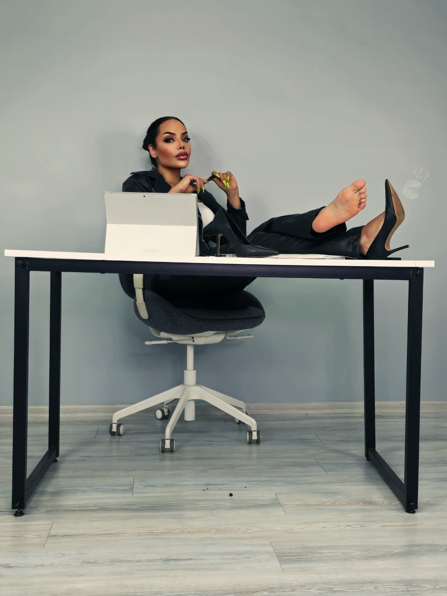 A professional portrait photograph of Raha Keshvar, looking confident and modern, representing her brand as an independent content creator.